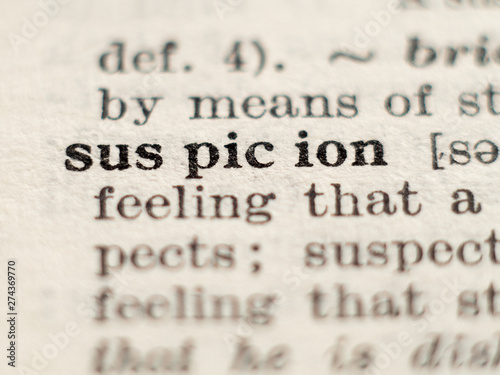 Dictionary definition of word suspicion, selective focus.