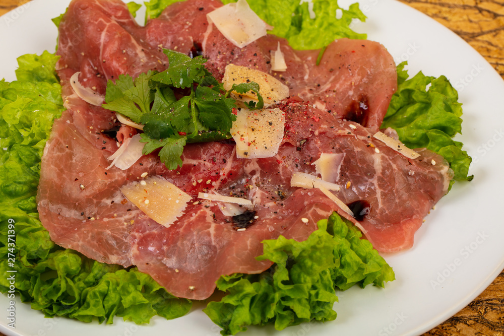 Beef carpaccio with parmesan cheese