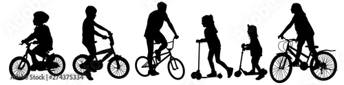 Children silhouettes riding bicycles and scooters