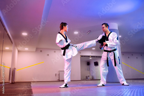 Para-taekwondo in purple-blue light background
