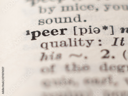 Dictionary definition of word peer, selective focus.