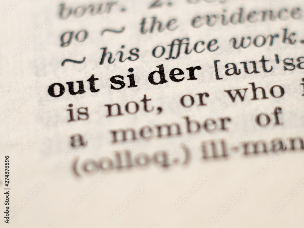 Obraz premium Dictionary definition of word outsider, selective focus.