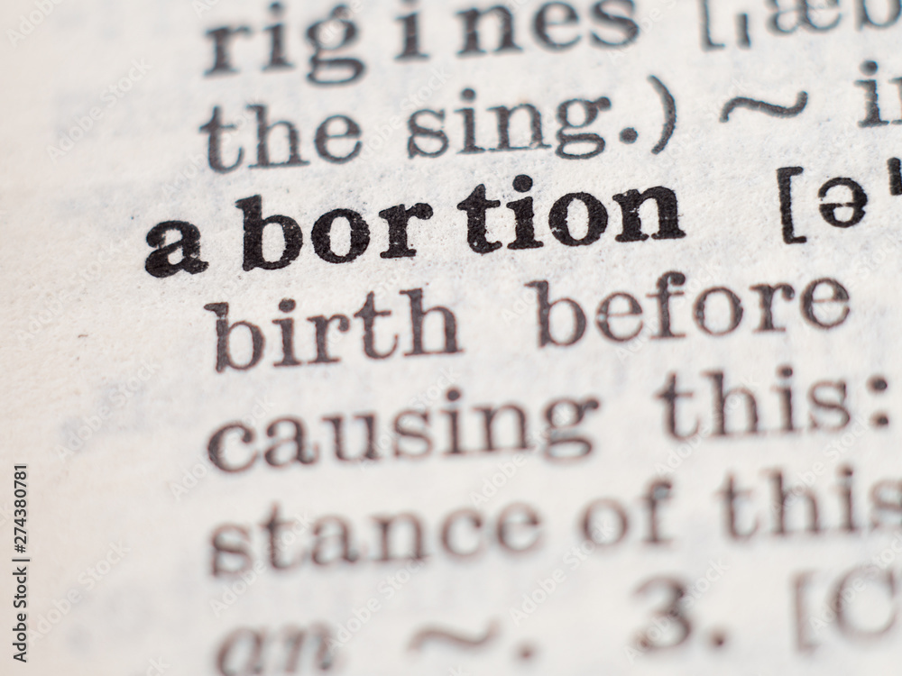 Dictionary definition of word abortion, selective focus. Dictionary definition of word abortion, selective focus.