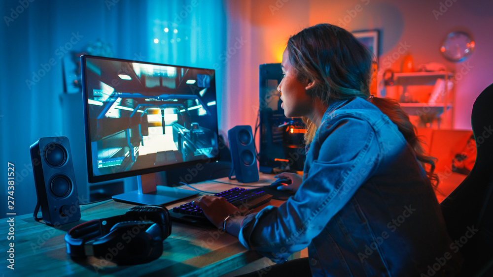 Premium Photo  Girl enjoying her free time by playing video games on  computer in game room