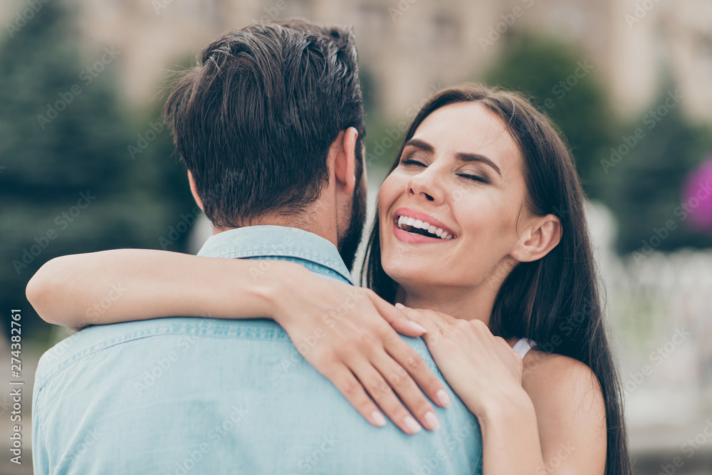 Close up photo of charming pretty youth millennial cuddle have fun weekend spring promenade free time enjoy wear blue denim jeans shirt town outside Close up photo of charming pretty youth millennial cuddle have fun weekend spring promenade free time enjoy wear blue denim jeans shirt town outside