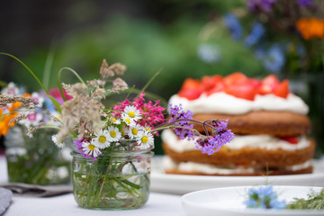 Scandinavian midsummer feast with strawberry cake