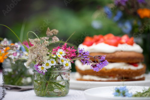 Bilde på lerret Scandinavian midsummer feast with strawberry cake