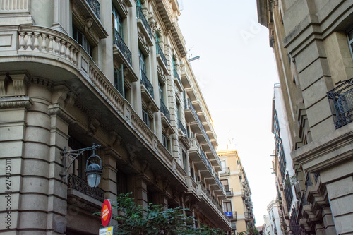 Barcelona, Spain - 26th July 2017 - People or tourists walking through a long alley to the shops