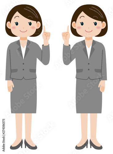 人差し指を出すスーツの女性　全身