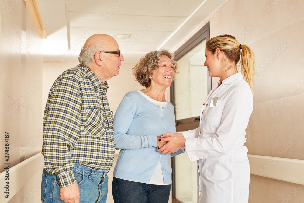 Seniors shake hands with geriatric nurse Seniors shake hands with geriatric nurse
