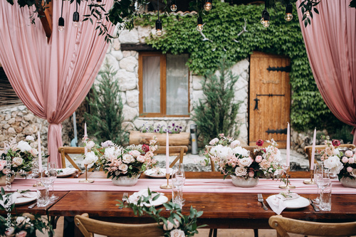 Rustic style wedding table decoration and floristics design photo