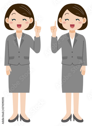 笑顔で人差し指を出すスーツの女性　全身