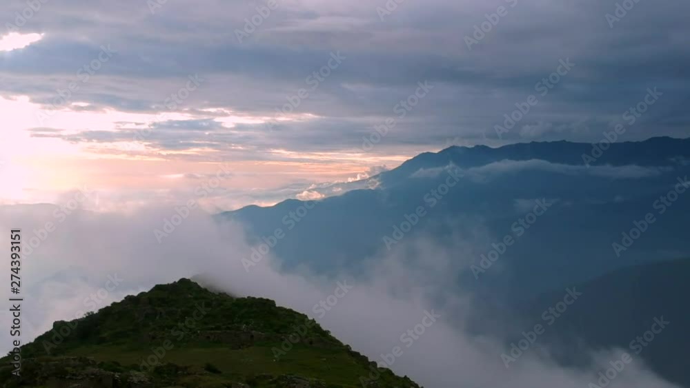 Clouds covering the peak of the mountain in The Andes of Peru Clouds covering the peak of the mountain in The Andes of Peru