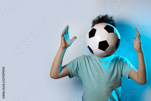 being in soccer ball instead of a head on a blue background © AHOOLY