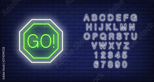 Green traffic light neon sign. Glowing illustration with round green traffic light sign. Can be used for roads, drivers, traffic