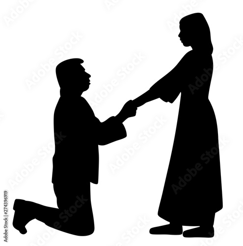 Man on knees holding hands of woman and asking her to marry