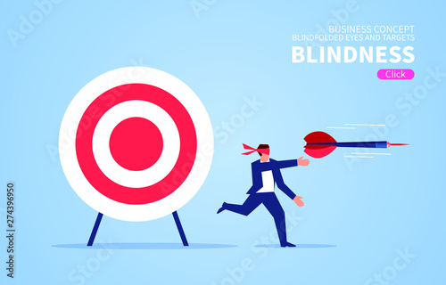 Blindfolded businessman using darts to shoot target © wei