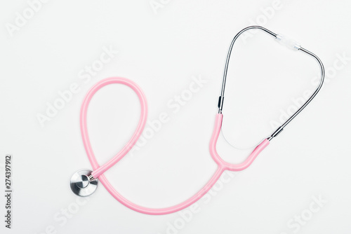 top view of stethoscope on white background, breast cancer concept