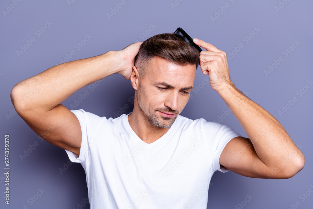 Close up photo amazing he him his middle age thought thoughtful macho hands arms plastic hair styling brush take care hairdo after barber shop visit wear casual white t-shirt isolated grey background Close up photo amazing he him his middle age thought thoughtful macho hands arms plastic hair styling brush take care hairdo after barber shop visit wear casual white t-shirt isolated grey background
