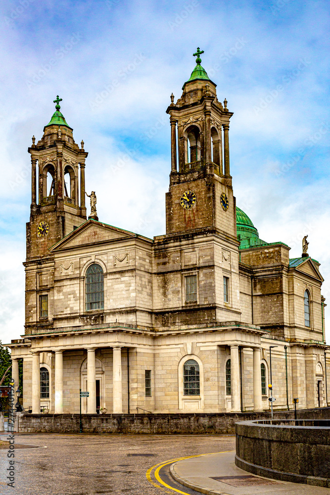 Facade of the parish church of Ss. Peter & Paul with their green domes in Athlone town, wonderful rainy day in the county of Westmeath, Ireland