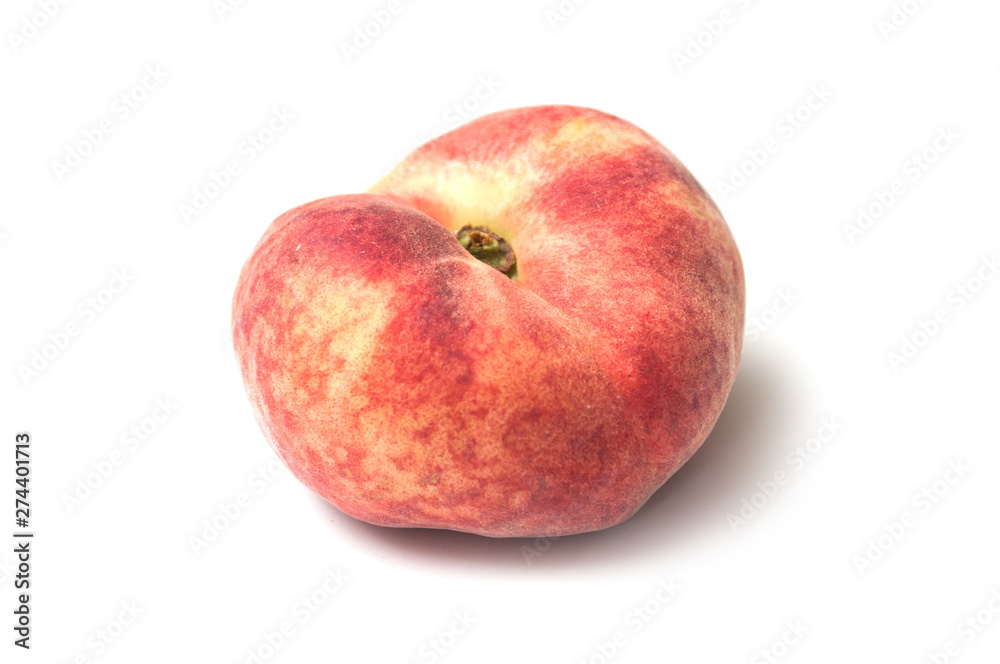 Closeup of organic flat peach on white background