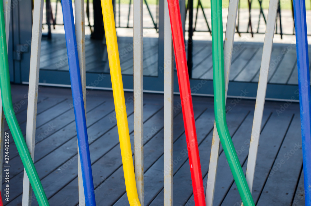 Abstract background of colored pipes. It`s colorful fence.