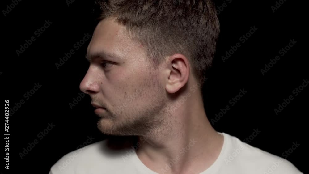 Caucasian man rotating head center to left. Close up shot. Caucasian man rotating head center to left. Close up shot.