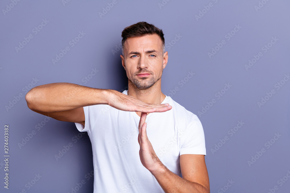 Close up photo amazing he him his middle age macho hand palm arm raised air time out sport symbol you will not pass through facial expression strict wear casual white t-shirt isolated grey background Close up photo amazing he him his middle age macho hand palm arm raised air time out sport symbol you will not pass through facial expression strict wear casual white t-shirt isolated grey background