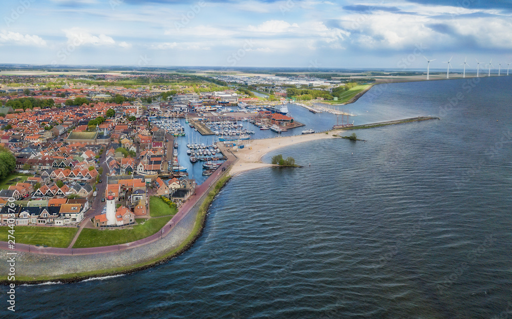 Aerial view of Urk with its lighthouse, a small coastal village on the IJsselmeer in the Netherlands..