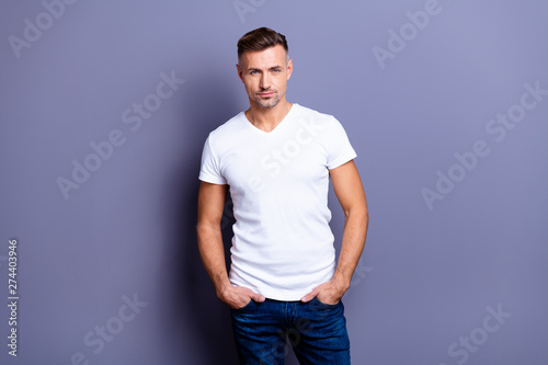 Close up photo amazing he him his middle age macho perfect appearance easy-going reliable person hands arms pockets wear casual jeans denim pants trousers white t-shirt isolated grey background