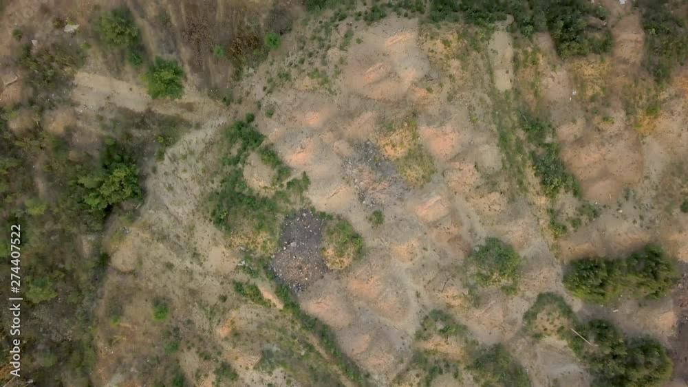 Construction site with heaps of sand and land on a summer evening at sunset. Aerial view. Wasteland for building buildings. Torn soil Construction site with heaps of sand and land on a summer evening at sunset. Aerial view. Wasteland for building buildings. Torn soil