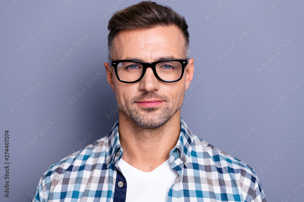 Obraz premium Close up photo handsome he him his guy intelligent reliable manager financier person peacefully cute not smile neat bristle beard wear specs casual plaid checkered shirt isolated grey background