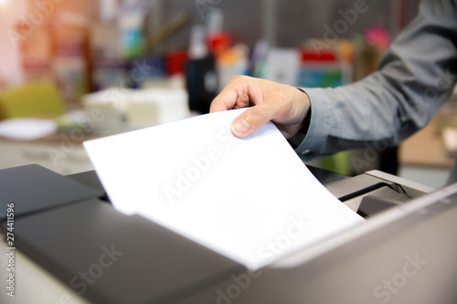 Fotografie Close-Up Shot Businessmen Put paper for using photocopiers.