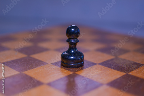 Black pawn in the foreground