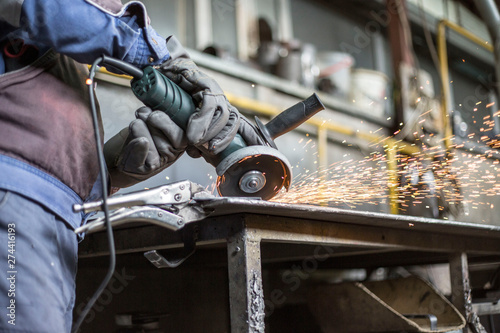 Grinding of materials in metallurgy workshop