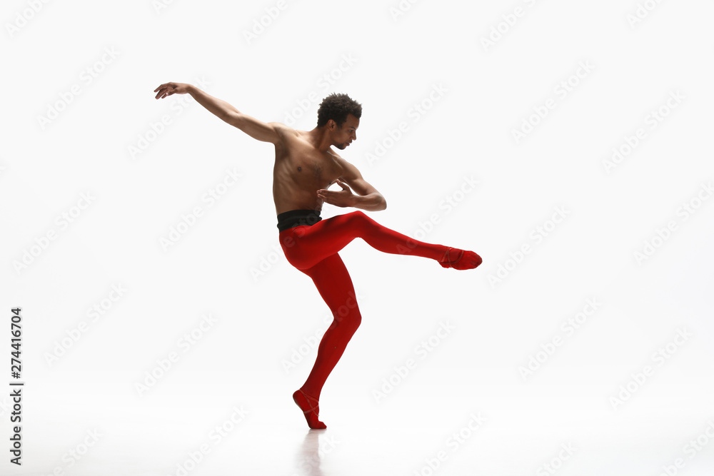 Graceful classic ballet dancer dancing isolated on white studio background. Man in bright red clothes like a combination of wine and milk. The dance, grace, artist, movement, action and motion concept