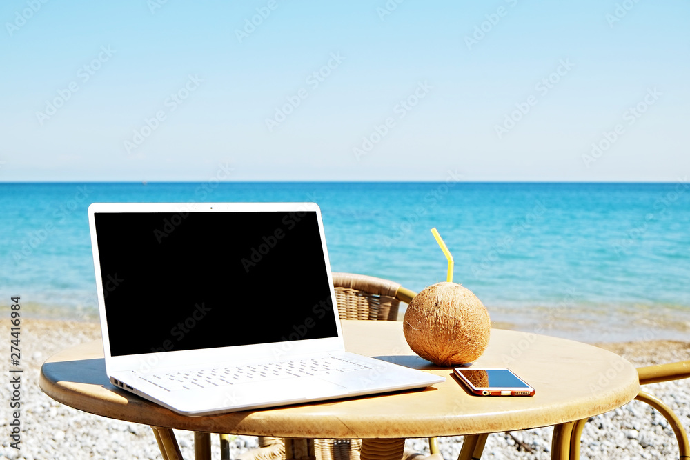 office on the beach, laptop with empty screen, sunglasses and tropical  cocktail Photos | Adobe Stock