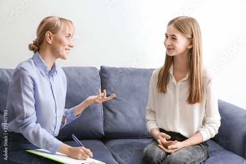 Female psychologist working...