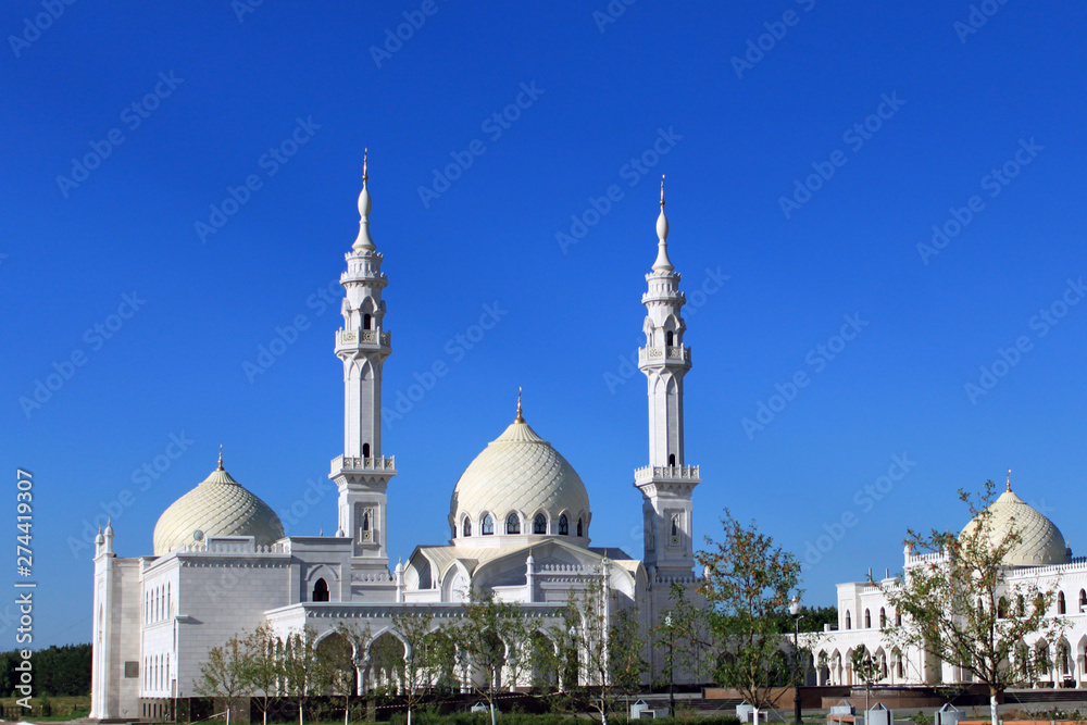 Fototapeta premium Beautiful white mosque on sky background