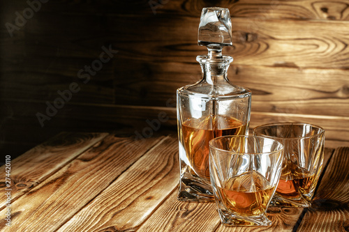 Canvas Print glasses with cognac, whiskey stand on the bar
