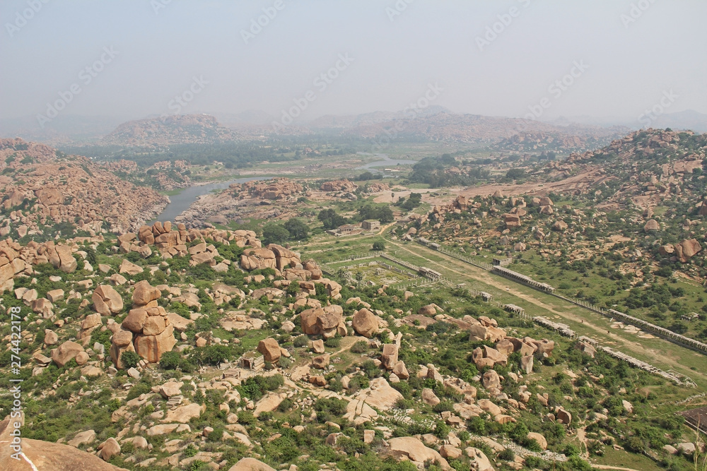 View of the unusual stone landscape and the ruins of Hampi from the hill Matanga. Sacred Center. Karnataka, India.