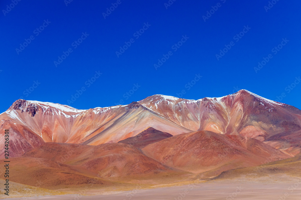 Naklejka premium Background with barren desert scenery in the Bolivian Andes, in the Nature reserve Edoardo Avaroa