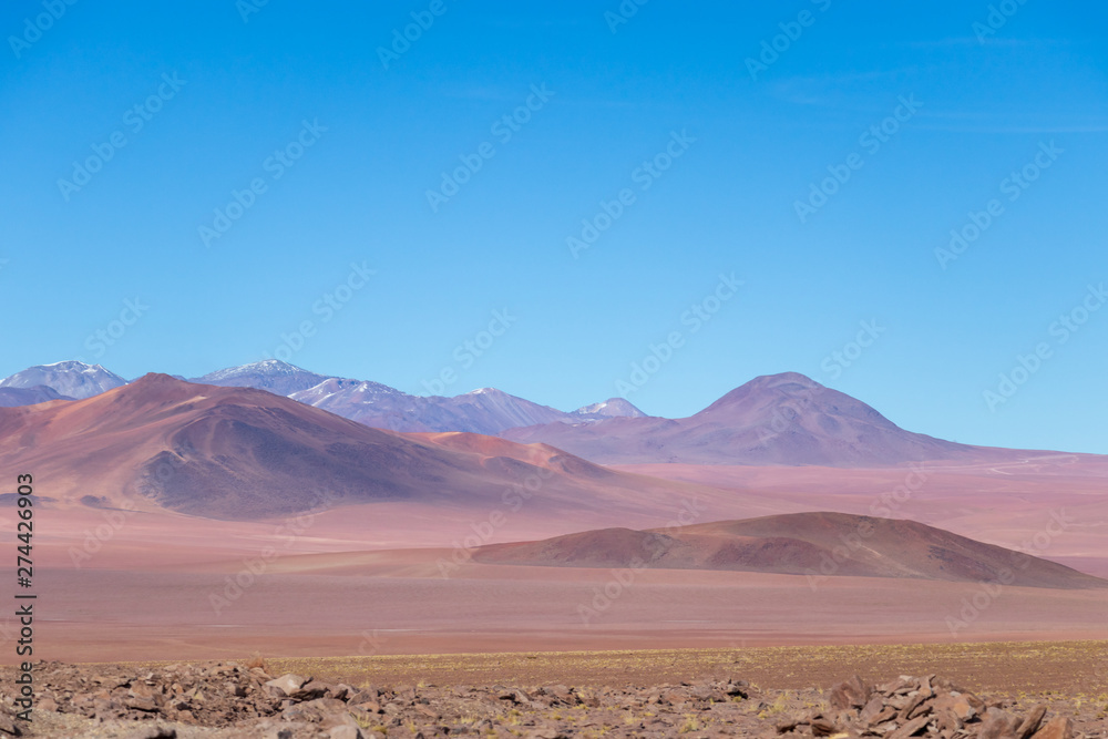 Background with barren desert scenery in the Bolivian Andes, in the Nature reserve Edoardo Avaroa Background with barren desert scenery in the Bolivian Andes, in the Nature reserve Edoardo Avaroa