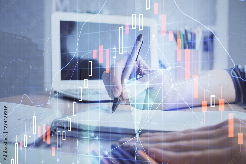 Financial forex charts displayed on woman's hand taking notes background. Concept of research. Double exposure Financial forex charts displayed on woman's hand taking notes background. Concept of research. Double exposure