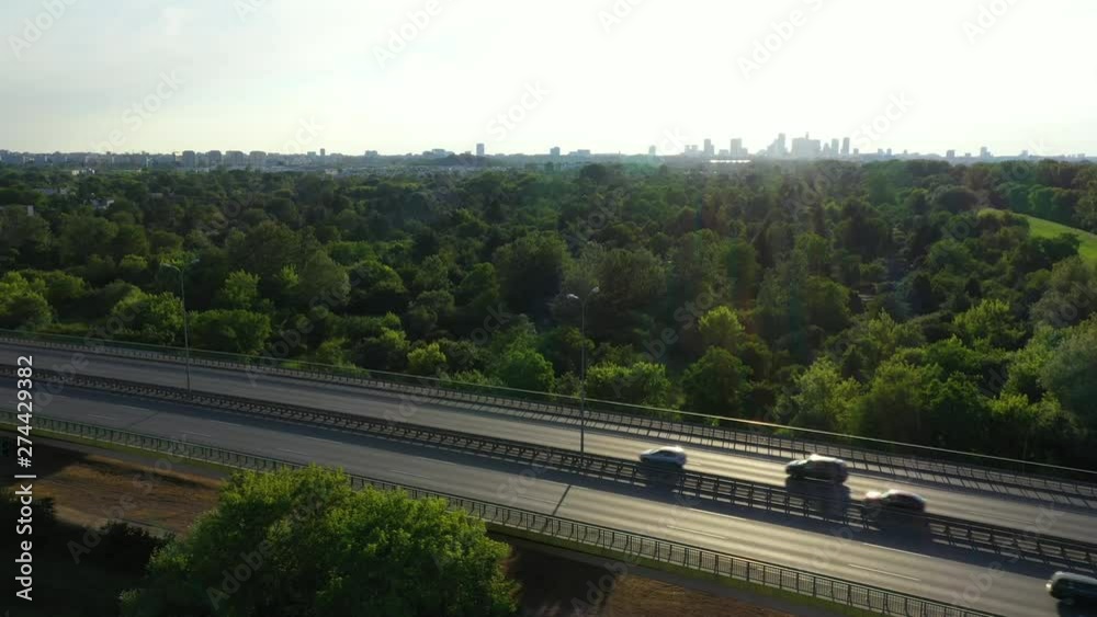 Aerial top down view of traffic jam on a car bridge and moving train. 4K video Aerial top down view of traffic jam on a car bridge and moving train. 4K video