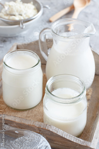 Fermented drink kefir in small bottles and kefir grains