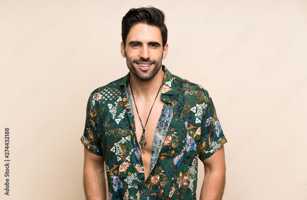Handsome man in summer shirt over isolated background Handsome man in summer shirt over isolated background