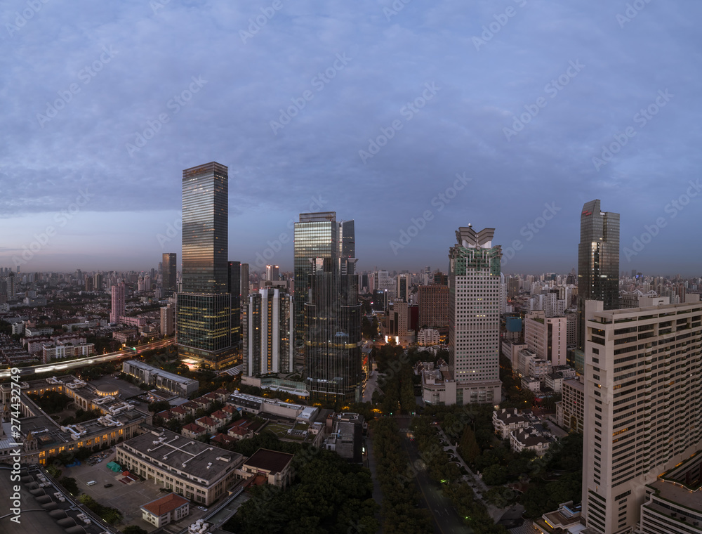 Fototapeta premium Aerial view of business area and cityscape in the dawn, West Nanjing Road, Jing` an district, Shanghai