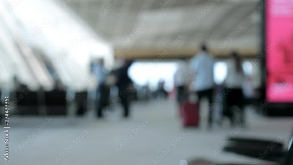 People are walking and carrying their suitcases at airport terminal, blur video. Travel concept. People are walking and carrying their suitcases at airport terminal, blur video. Travel concept.