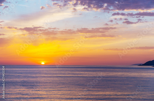 Fototapeta Naklejka Na Ścianę i Meble -  Bright sunrise over the sea.